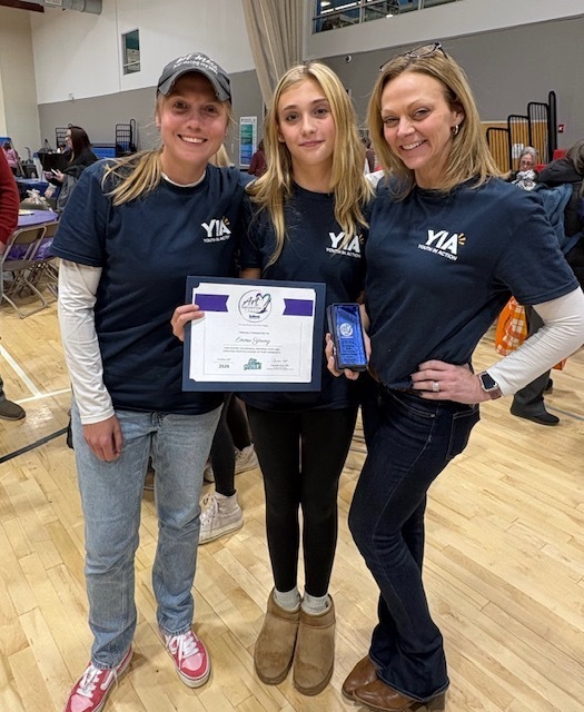Emma posing with her two Youth In Action advisors, Mrs. Kimball and Mrs. Diorio