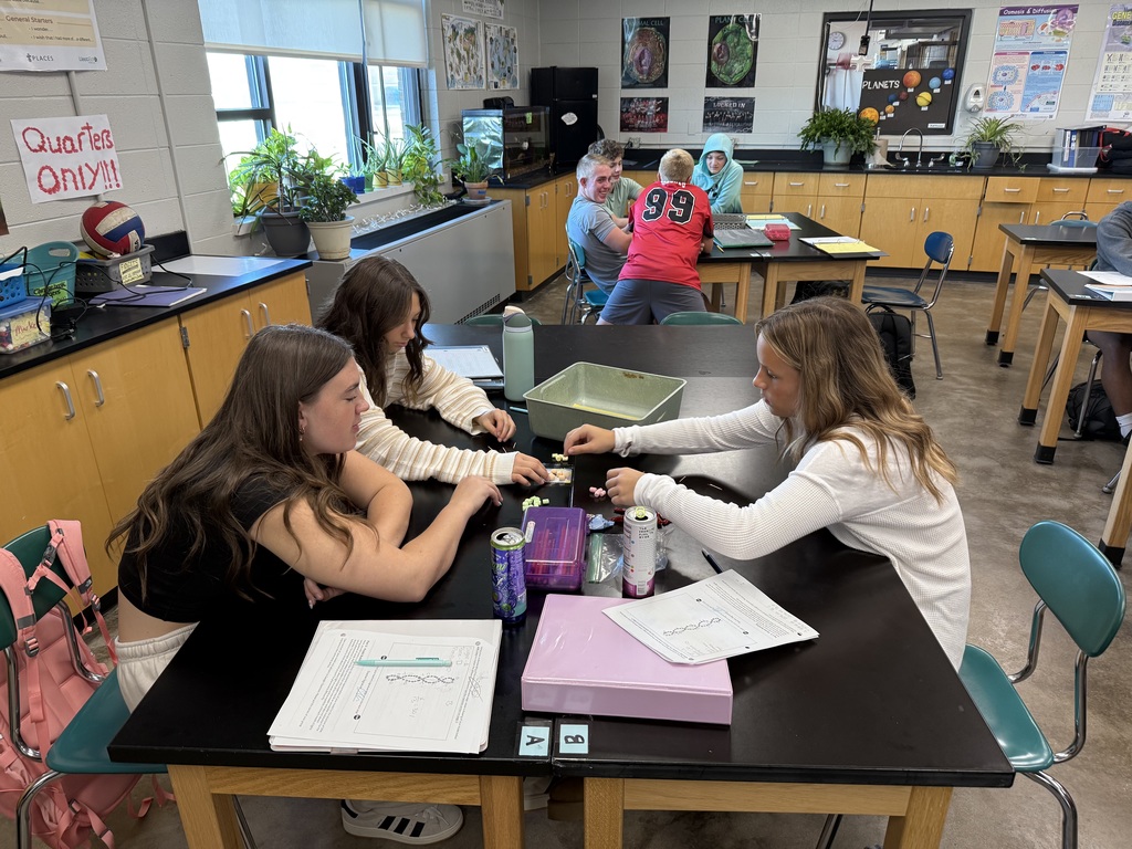 Three students building a 3D model