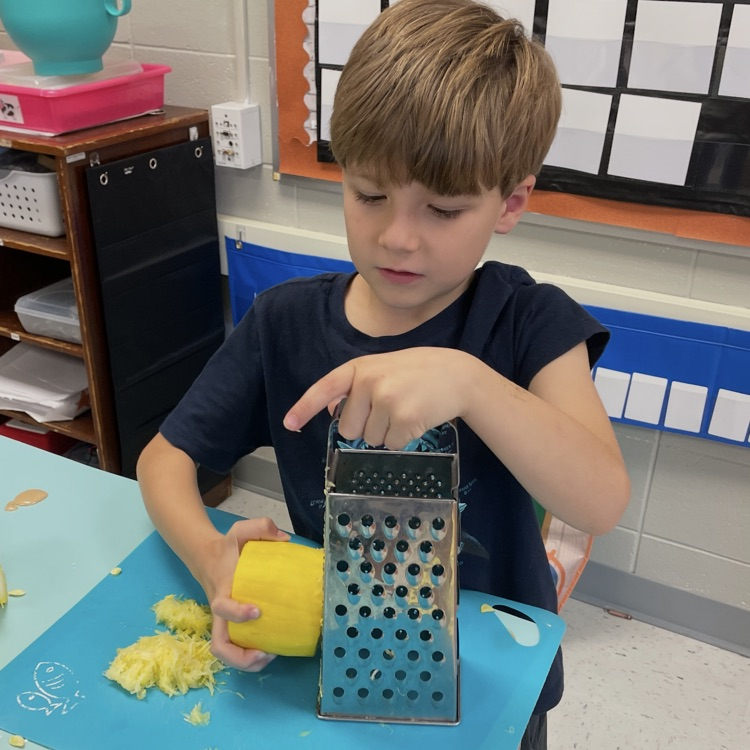 Learning how to use a grater!