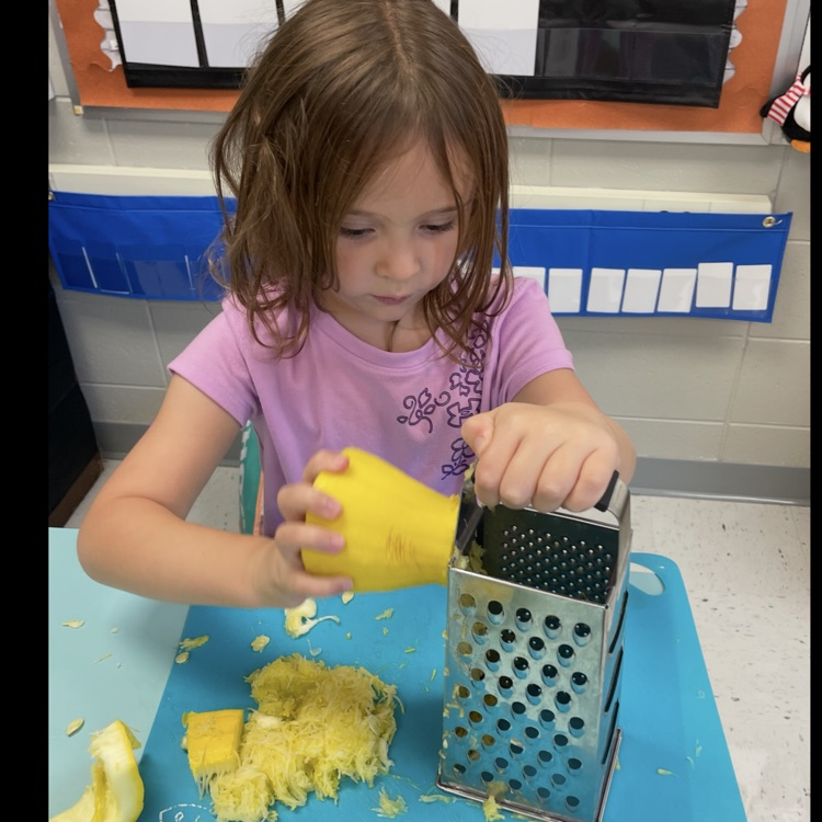 Learning how to use a grater!