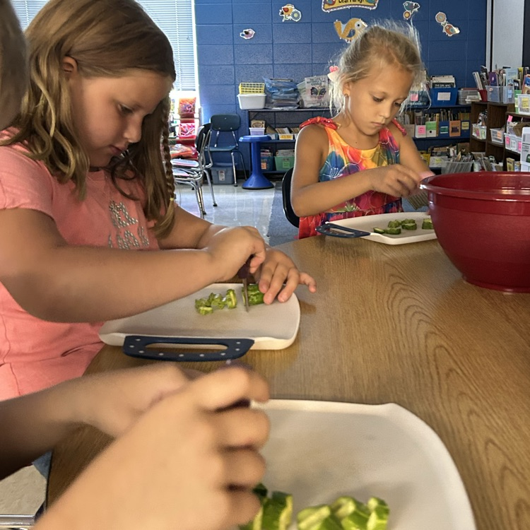 Carefully cutting cucumbers !