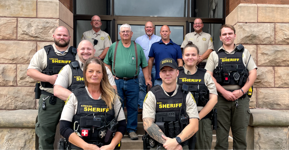 Group photo of Andrew County’s new School Resource Officers with county commissioners and sheriff’s office leadership.