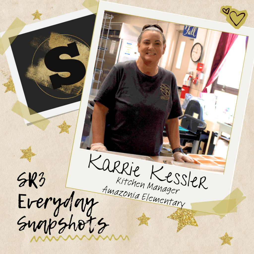 Karrie Kessler, Kitchen Manager at Amazonia Elementary, smiling while working in the school kitchen.