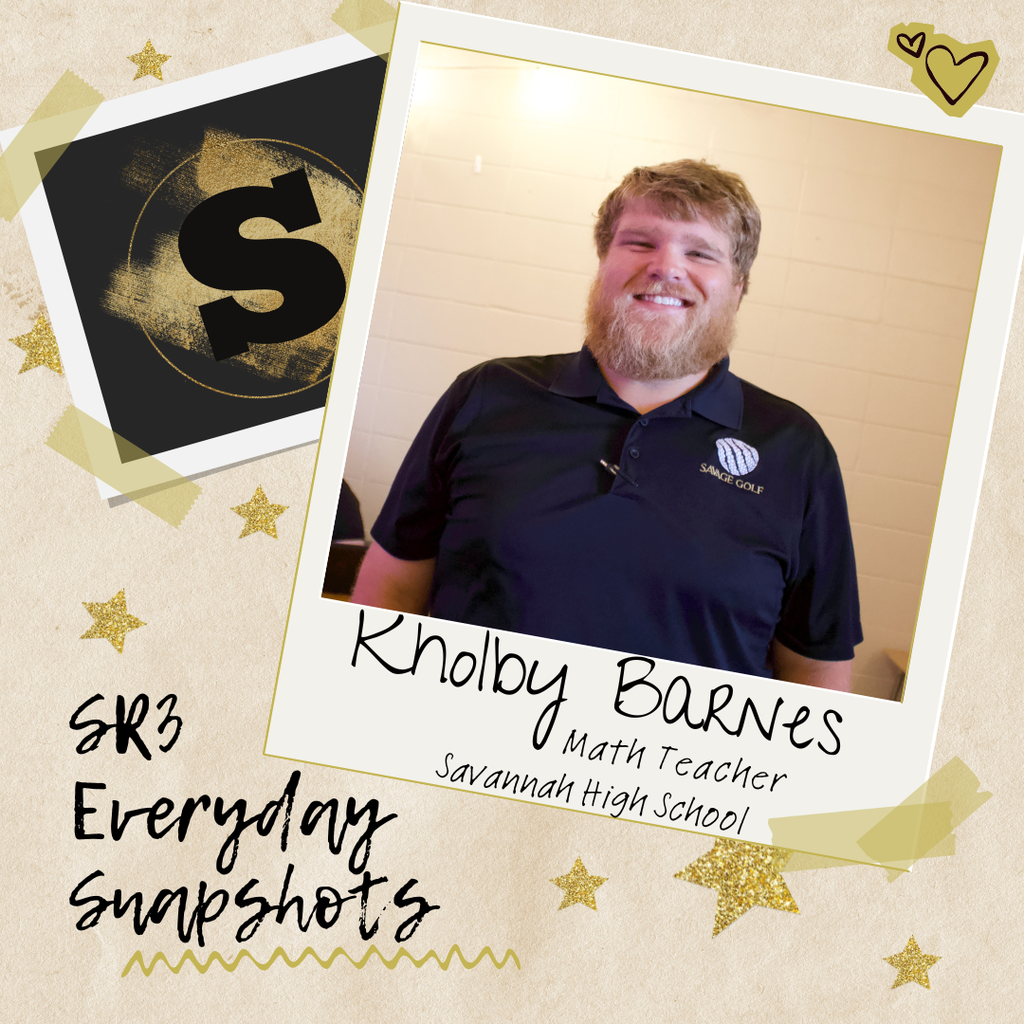 Math teacher Kholby Barnes smiles while standing in a Savannah High School classroom.