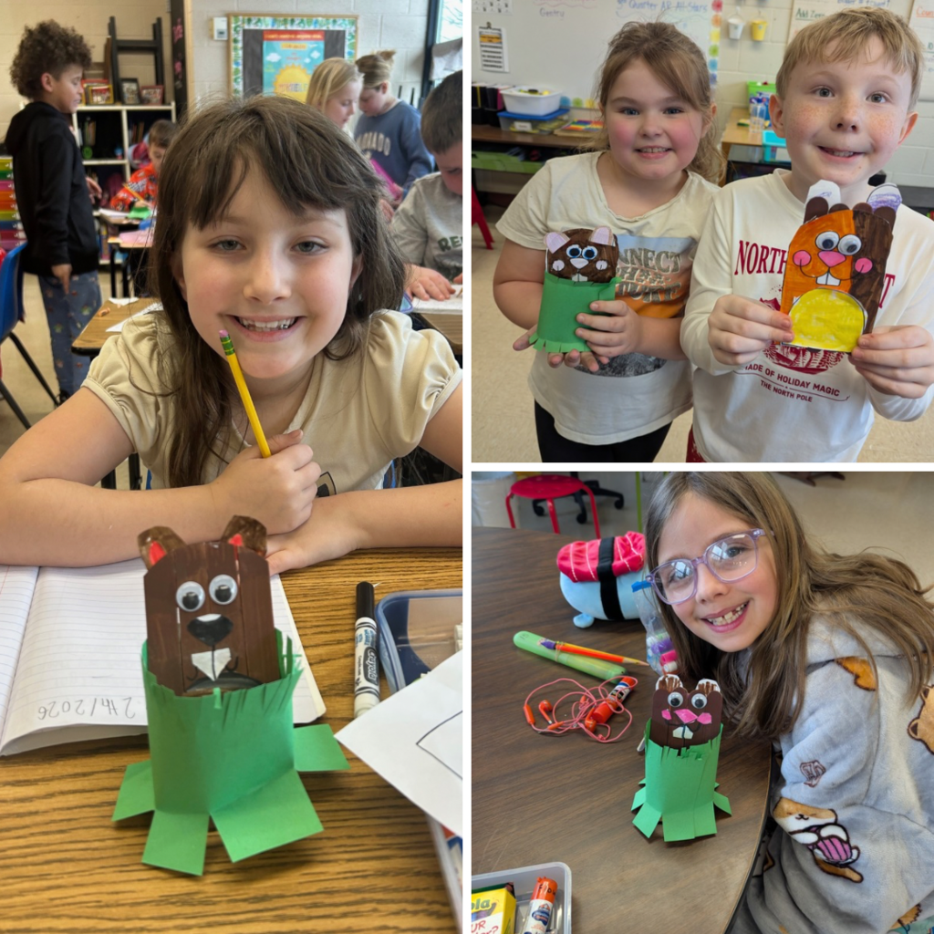 Elementary students smiling in classrooms while holding handmade paper groundhog crafts and drawings