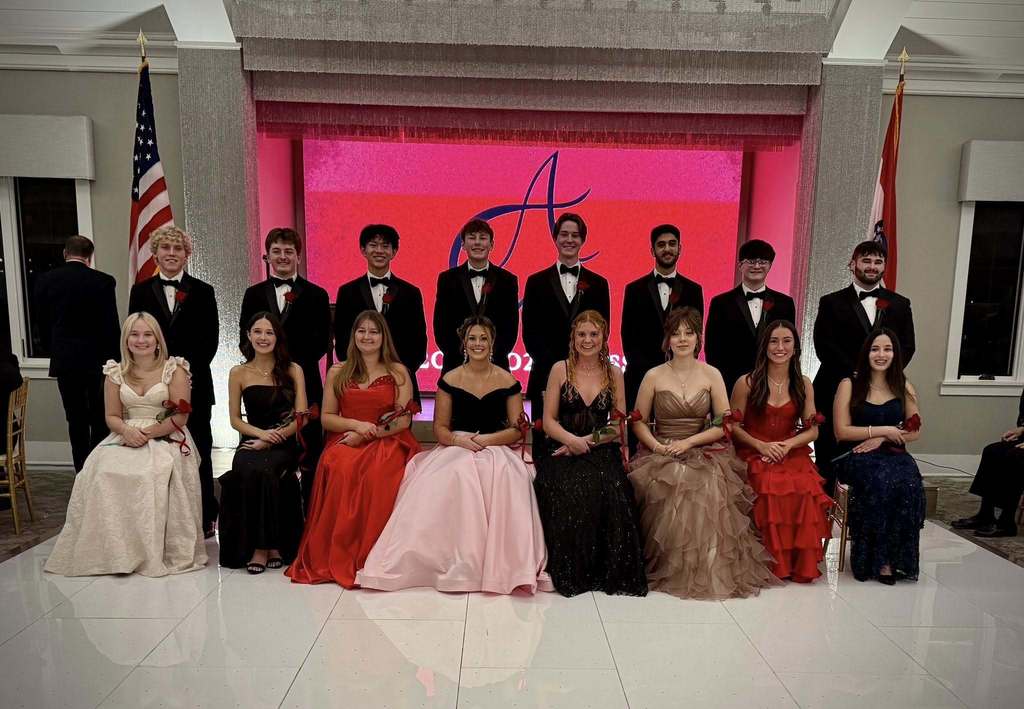 Cotillion honorees pose in formal attire; three Savannah High School seniors stand among the group.