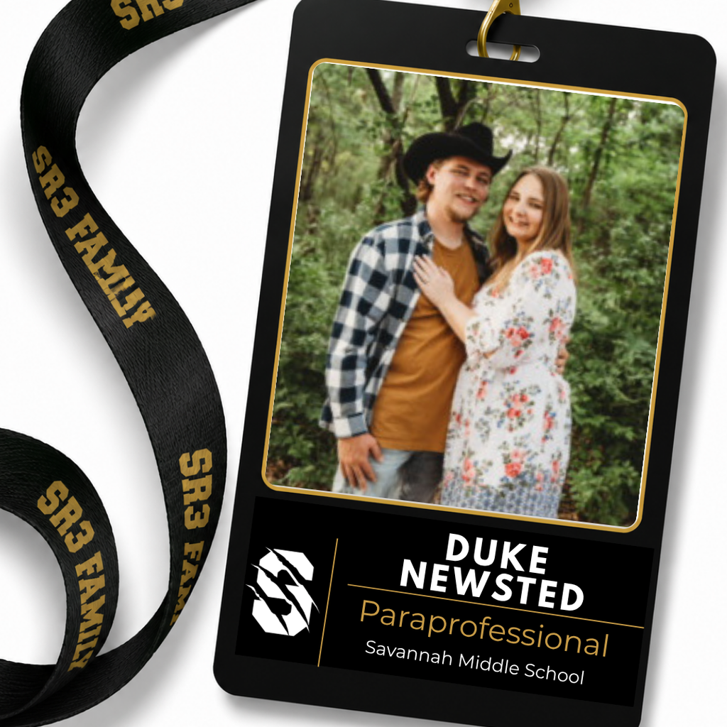 Black SR3 staff ID badge hanging from a black "SR3 Family" lanyard on a white background. The badge features a portrait of Duke Newsted. Text identifies him as a Paraprofessional, Assistant Varsity Wrestling Coach, and Assistant Middle School Track Coach serving Savannah Middle School and Savannah High School.