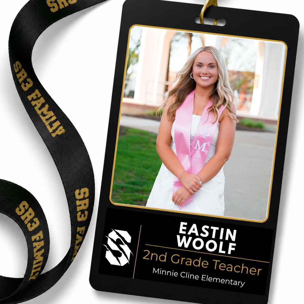 Portrait of new Minnie Cline Elementary second grade teacher Eastin Woolf smiling outdoors in graduation attire.
