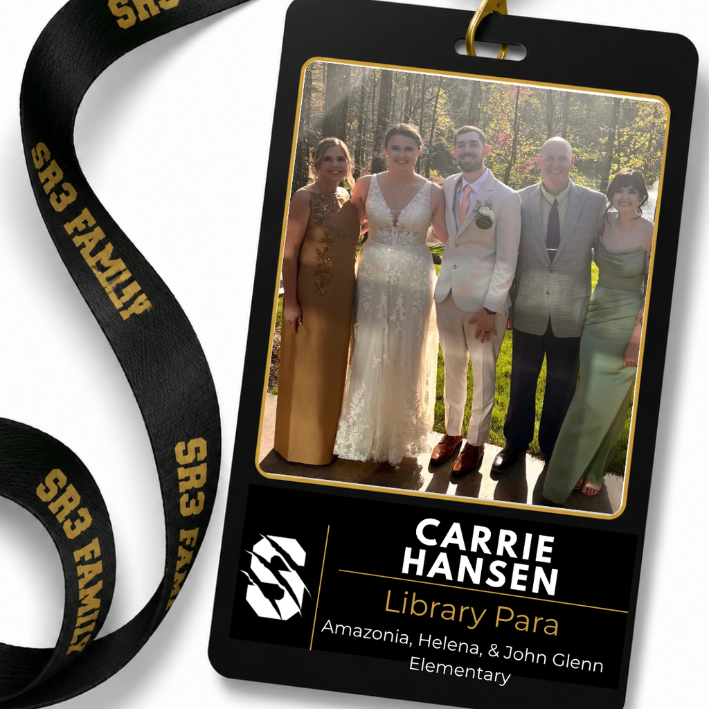 Carrie Hansen, Library Paraprofessional for Amazonia, Helena, and John Glenn Elementary, is featured on an SR3 staff ID badge graphic with a family photo taken at a wedding.