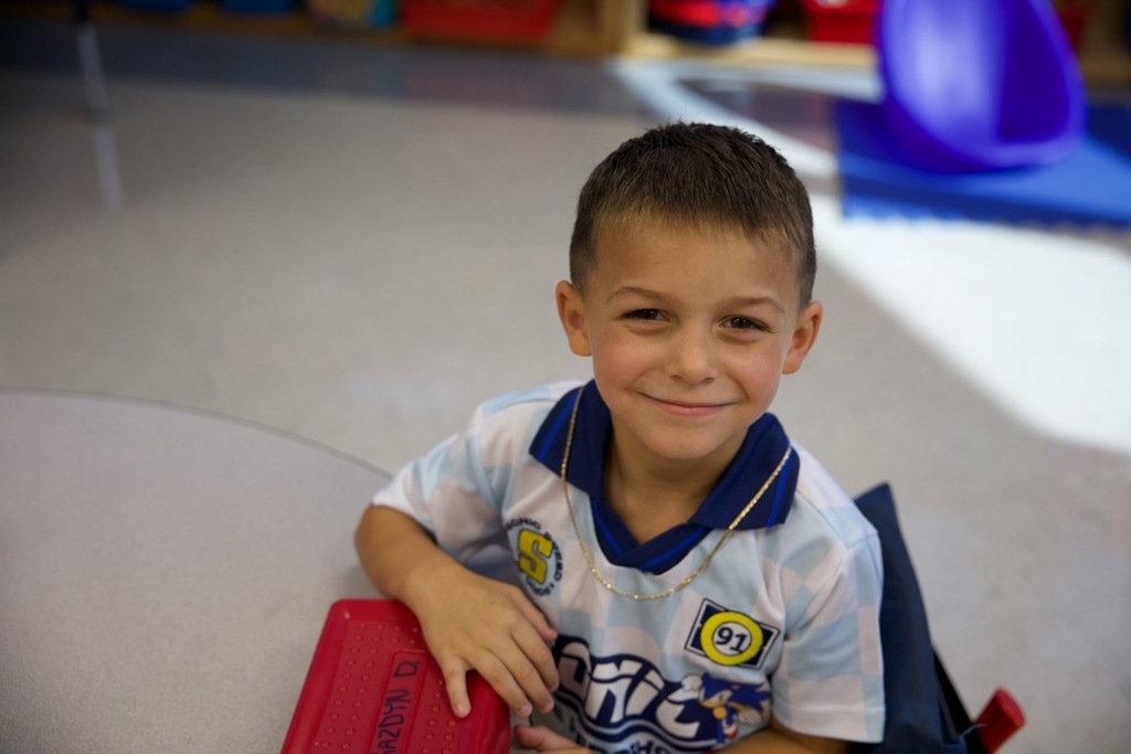 Student smiles for the camera on the first day of school