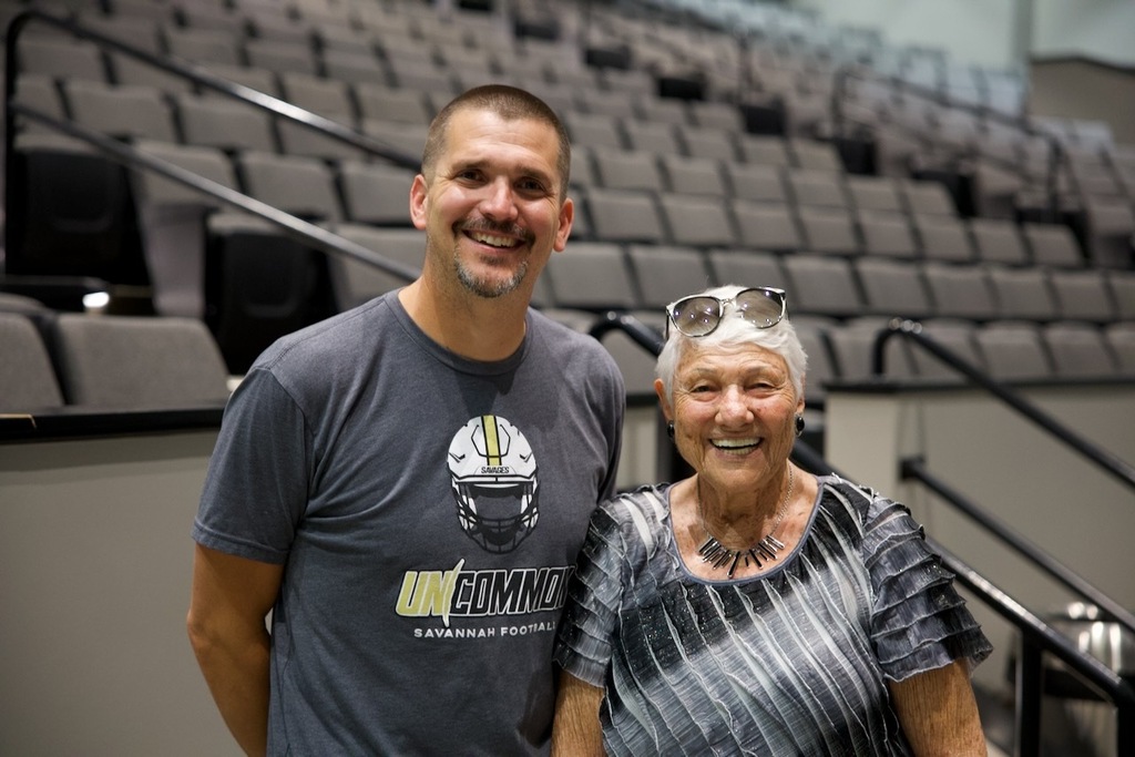 Analise Duncan smiles alongside a Savannah staff member inside the new SHS Performing Arts Center.