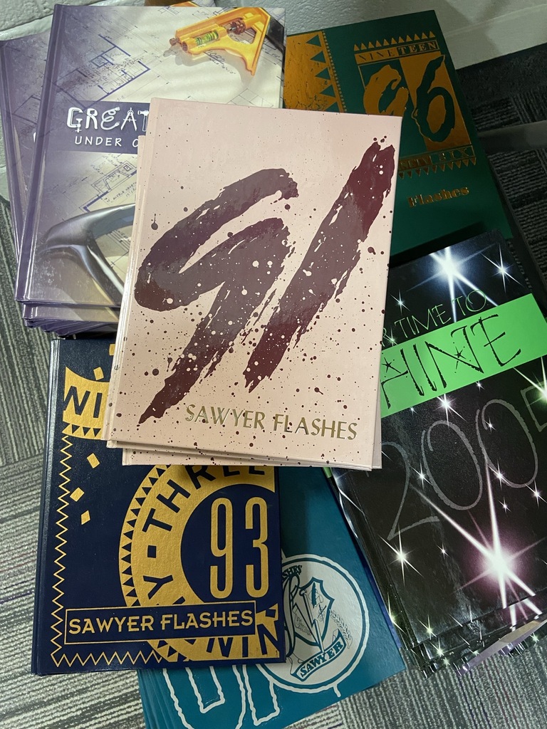 1991, 93, 96, 2005 Sawyer flashes year books