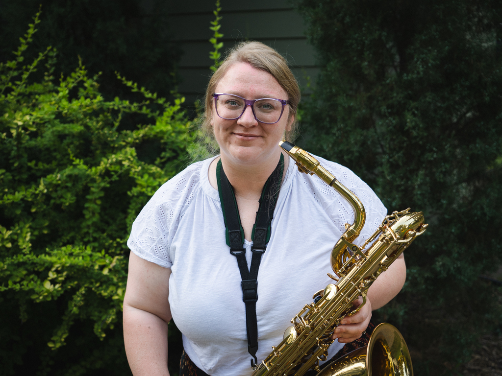 Mrs. Basden holding a saxophone