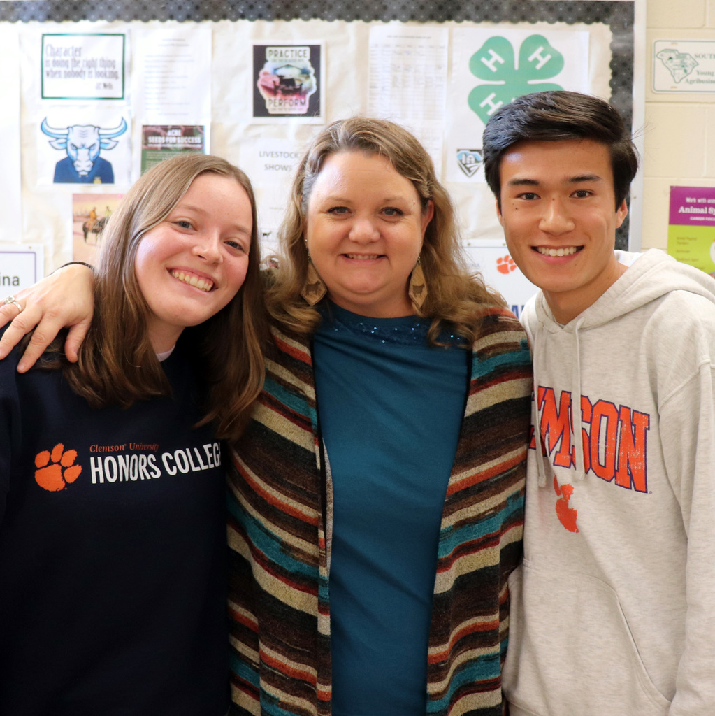 Mrs. Templeton visits with alumni Katie and Jake.