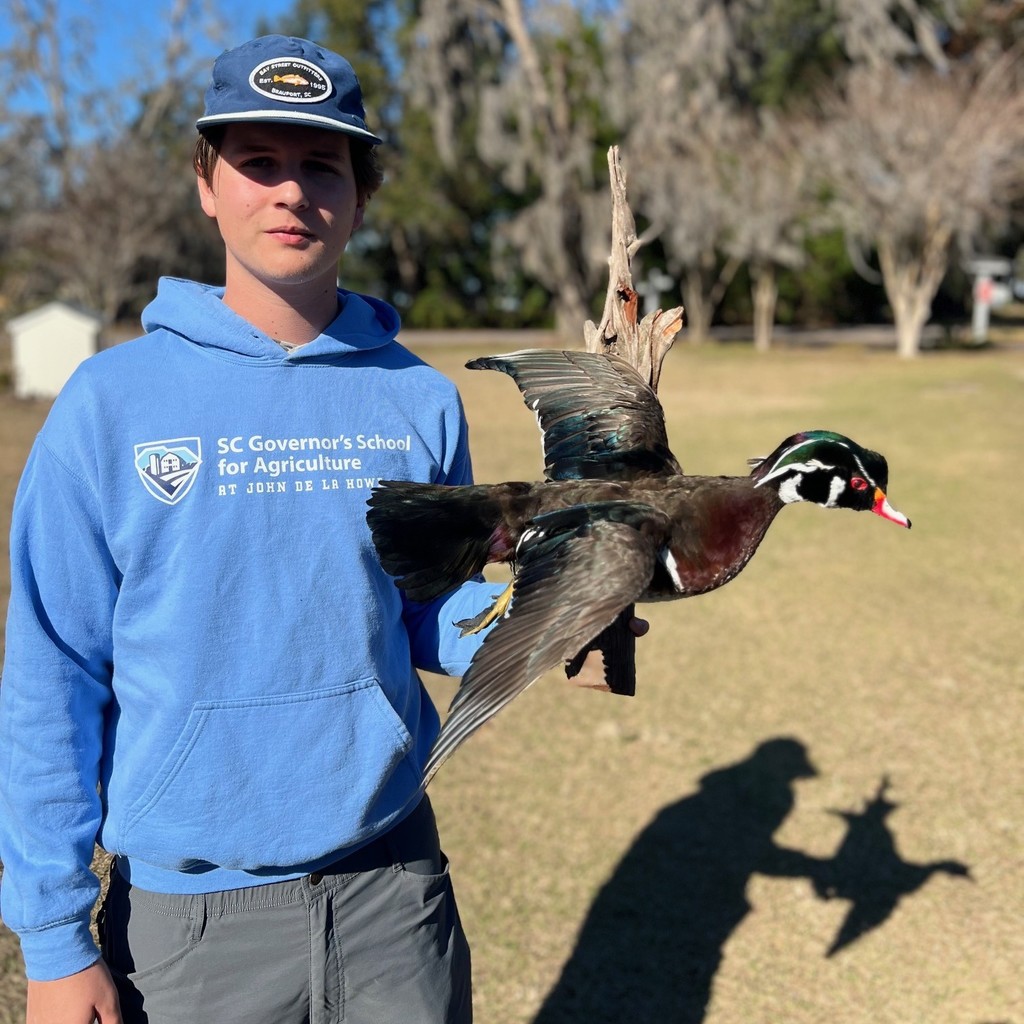 Cooper Harrison picked up his mounted trophy duck.