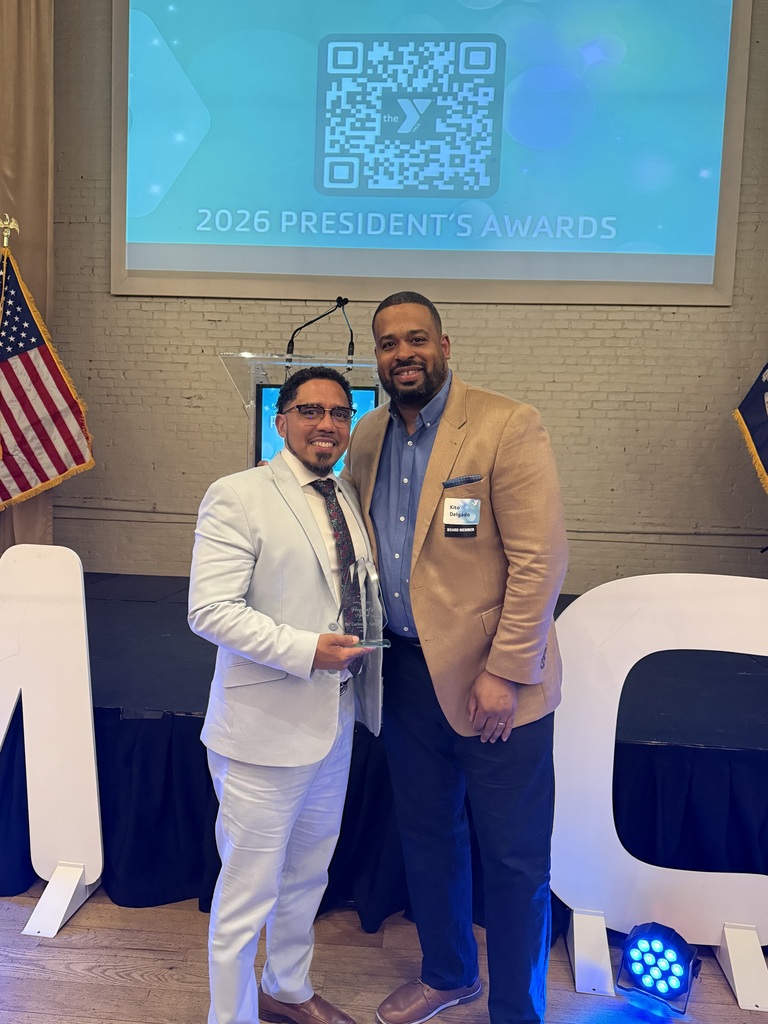 Photo of Dr. Cotto after receiving the YMCA award