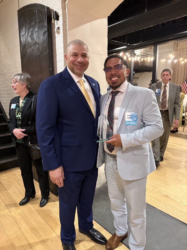 Dr. Cotto receiving YMCA award