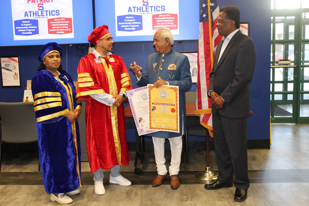 Photo of Dr. Cotto receiving award