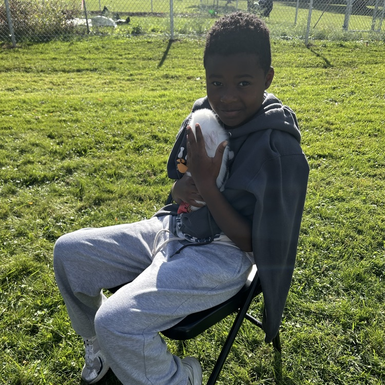 student with chicken