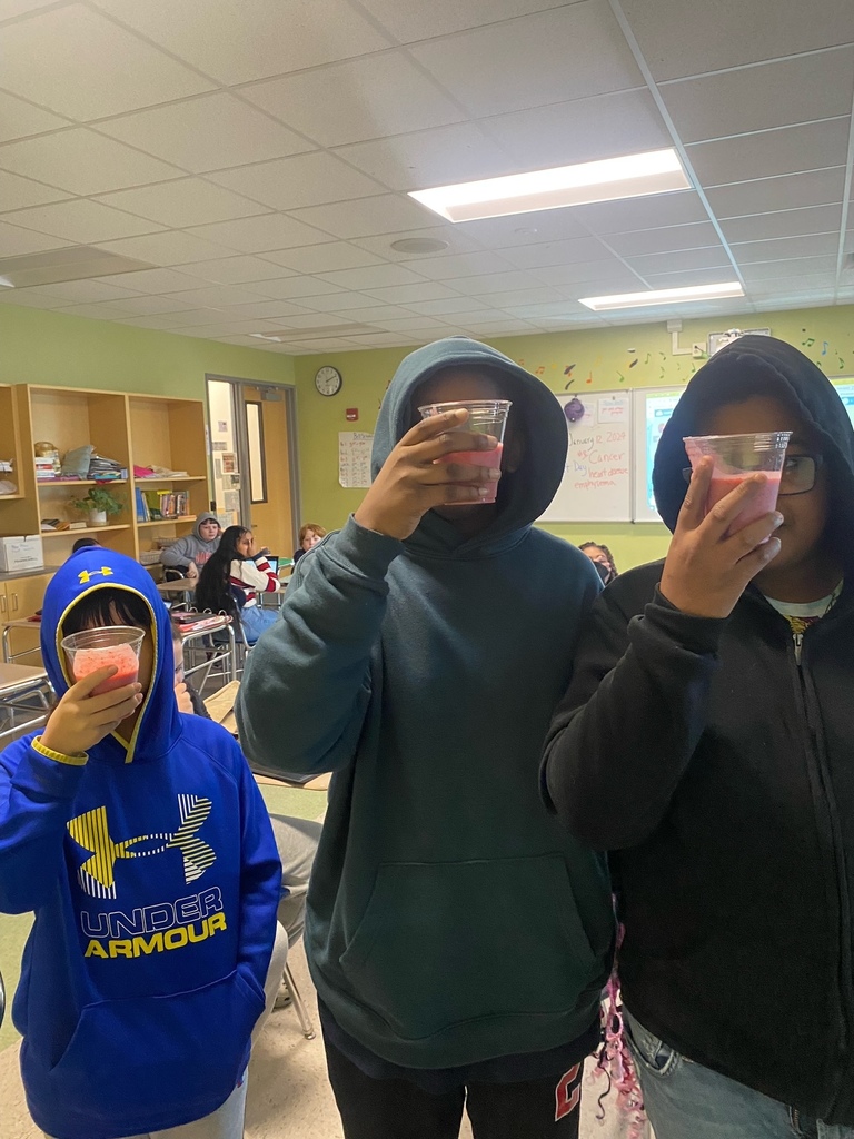 group of 3 students taste smoothie