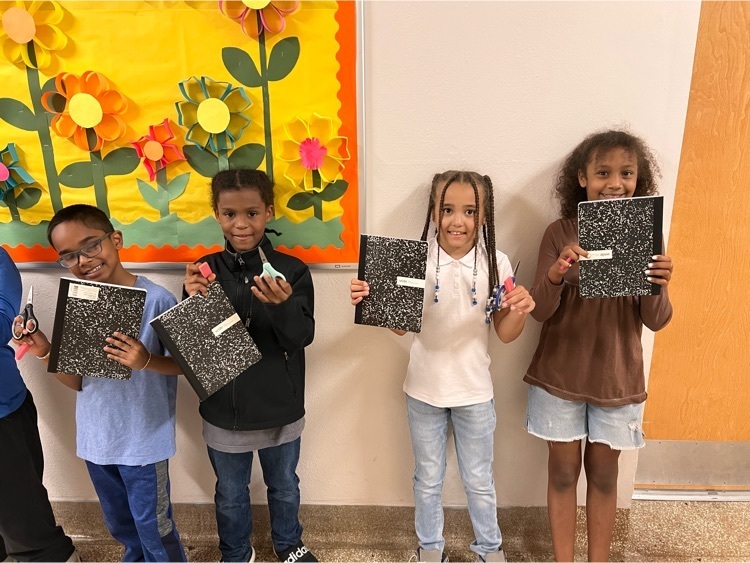 group of students pose with supplies