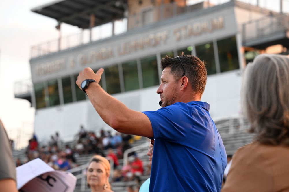Man talking to group at Lehnhoff Stadium