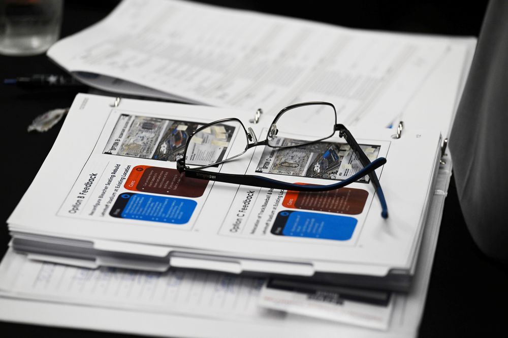 Pair of glasses sitting on top of notebook