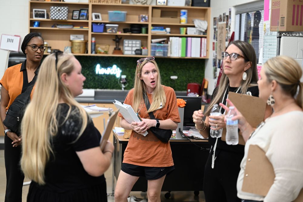 CAC members discuss their findings during the tour of Samuel Clemens HS