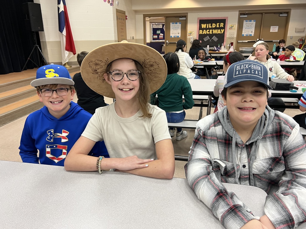 Wilder students show off their favorite hats during lunch.