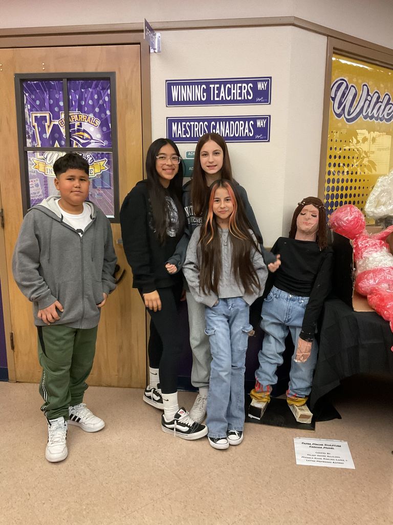 Wilder students posing infront of thier sculpture art for Big Art Day 2025
