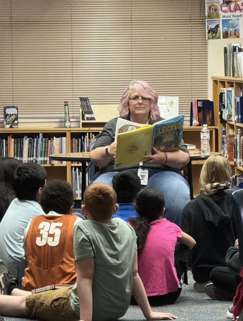 Mrs. Williams, the librarian reading to the 5th graders