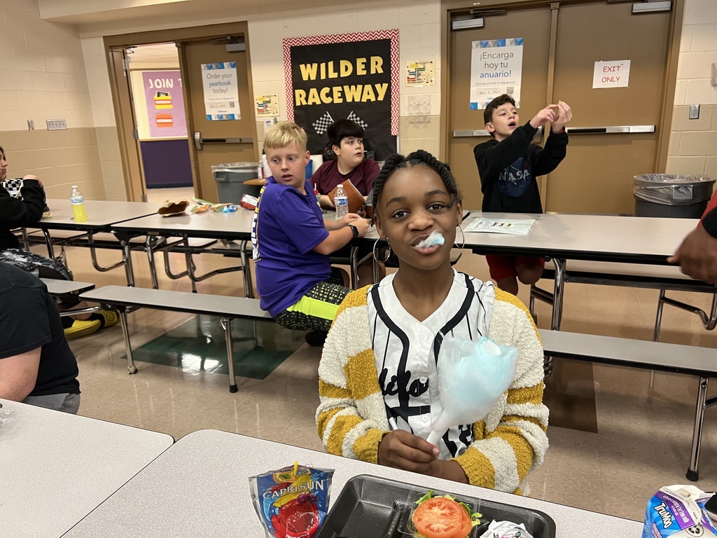 6th grader taking a bite out of her cotton candy