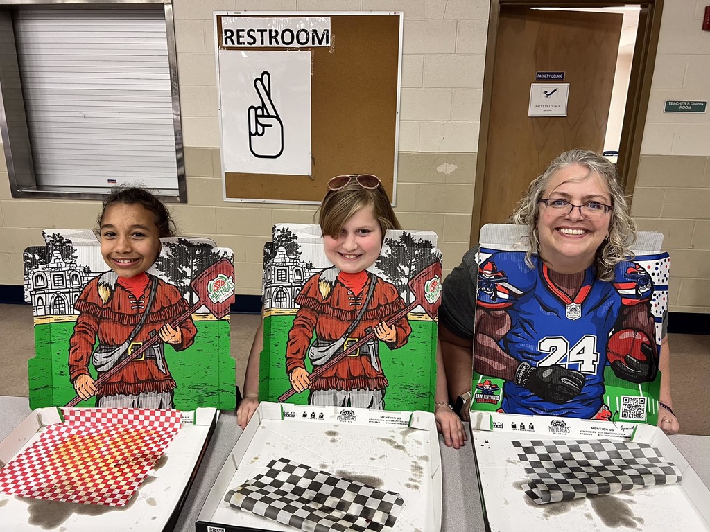 Mrs. Williams being silly and posing with students
