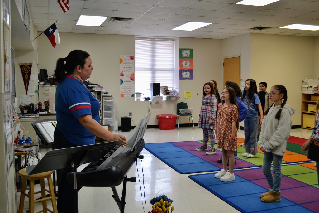4th grade Wildcat Singers practice after school. 