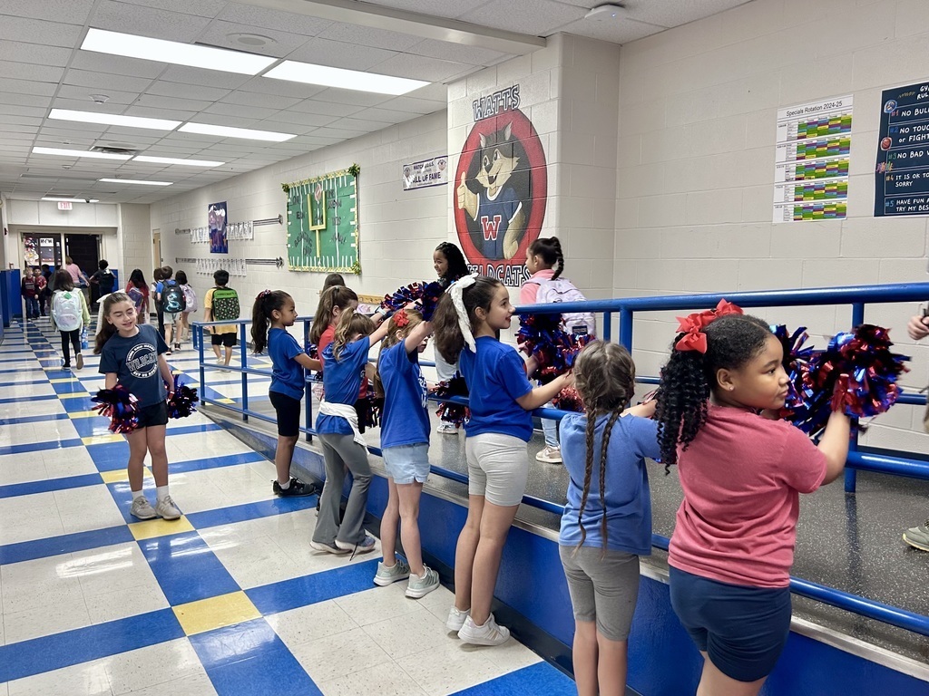 Cheer Cat team welcoming students during arrivals.