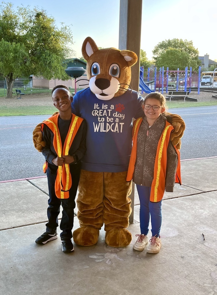 Safety Patrol students with campus Mascot during morning arrivals.