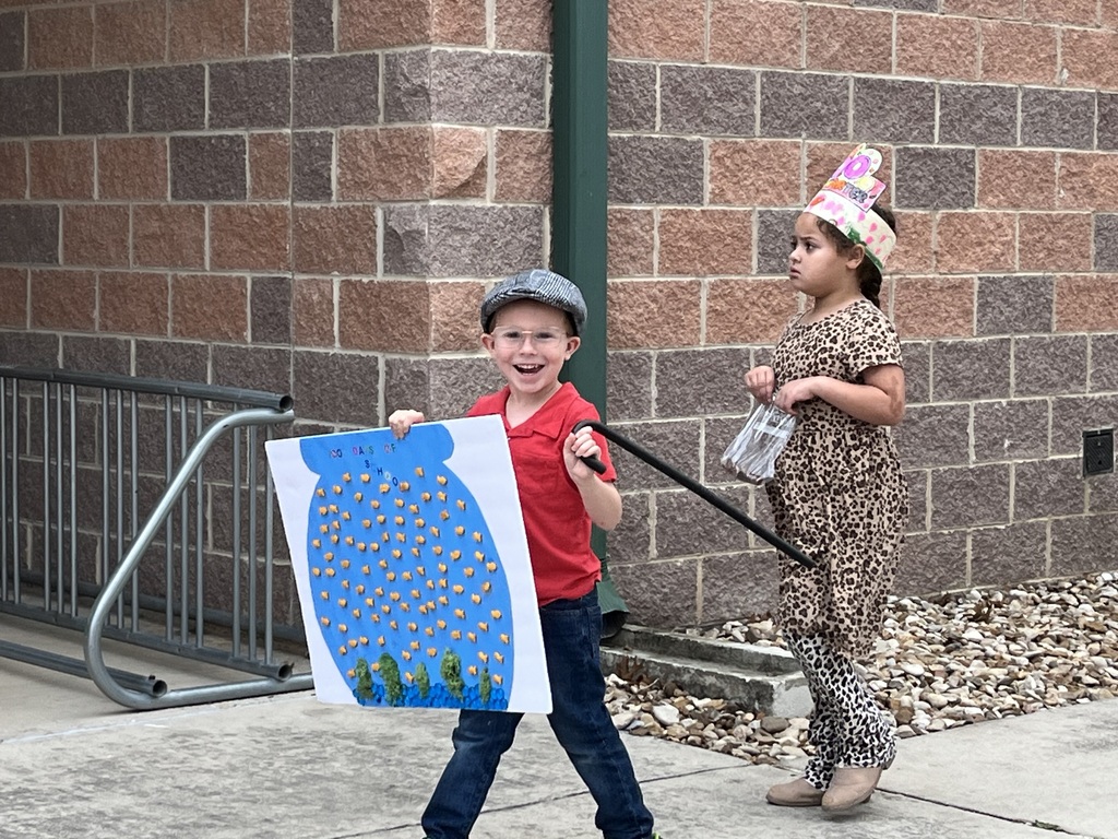 Celebrating the 100th day of school with a student parade.