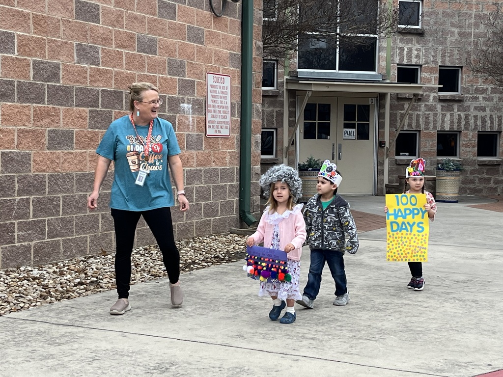 Celebrating the 100th day of school with a student parade.