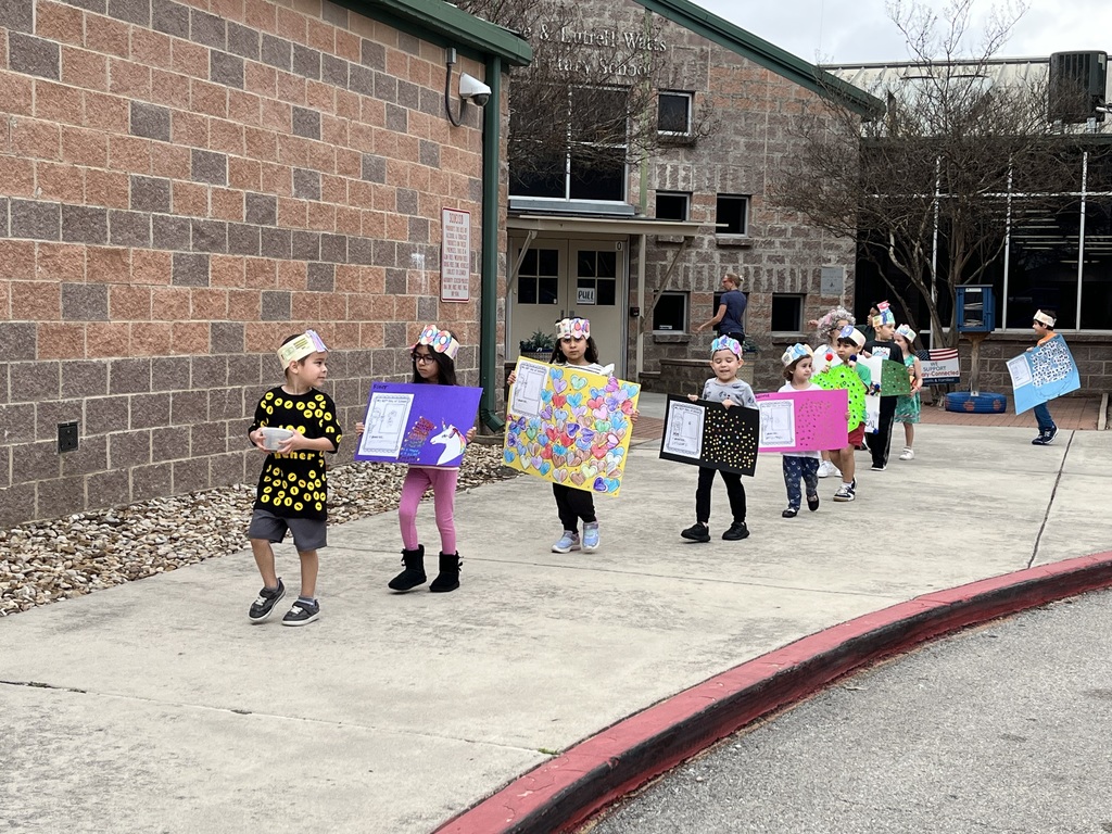 Celebrating the 100th day of school with a student parade.