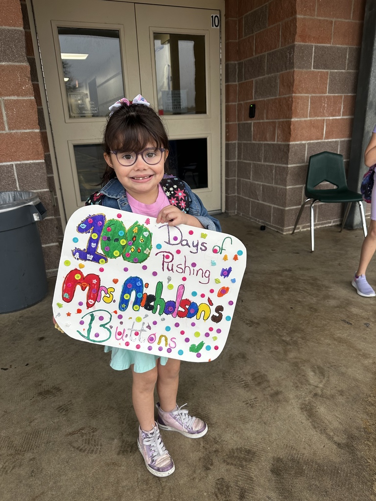 Celebrating the 100th day of school with a student parade.
