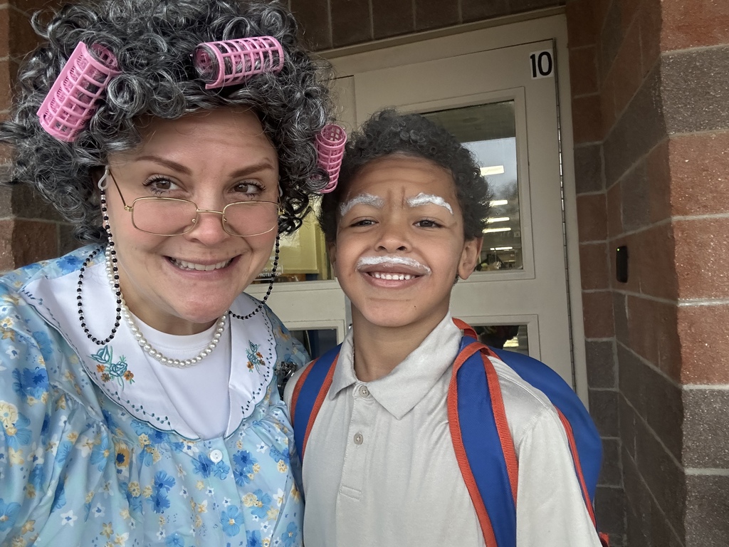 Celebrating the 100th day of school with a student parade.