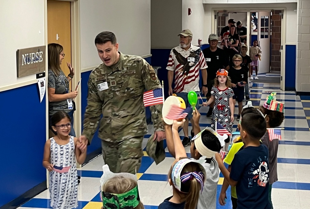 students and their families celebrating and honoring active duty and veteran military members.