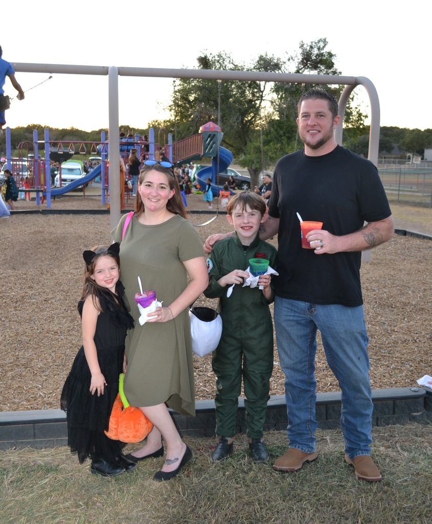 students and their parents attending their school's fall family event. 