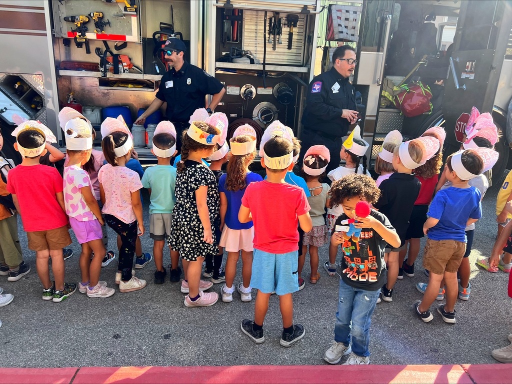 students learning about fire safety and what the local firefighters do when they respond to emergencies.