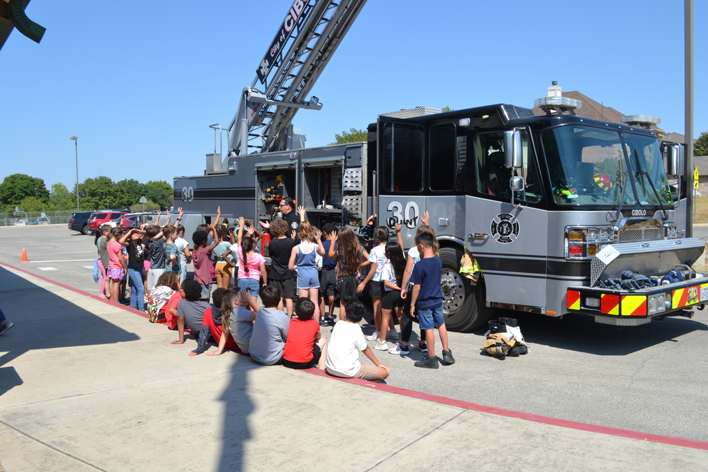 students learning about fire safety and what the local firefighters do when they respond to emergencies.