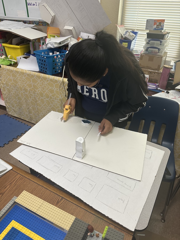 student mapping out geo city project.