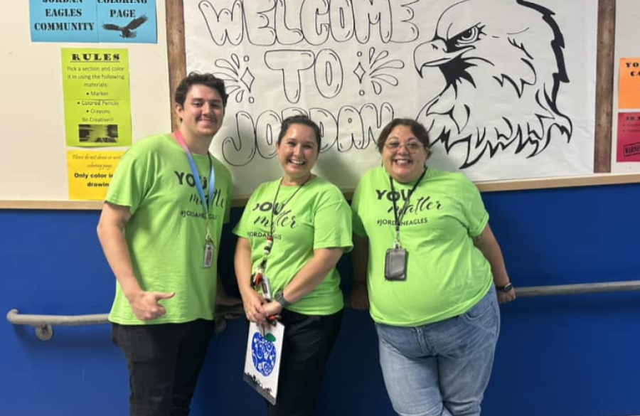 teachers posing together in the hallway