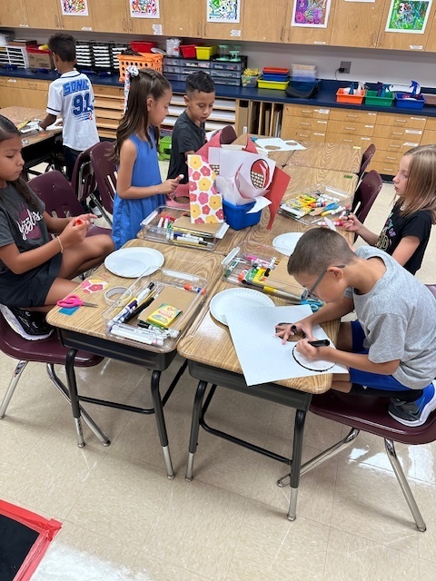 Students working on wildflowers in art.