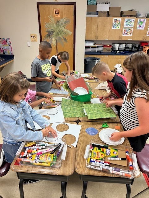 Students working on wildflowers in art.