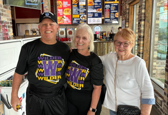 Family wearing wilder shirts at Willie's